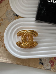 Vintage Chanel gold interlocking CC brooch, refined Paris luxury designer jewelry