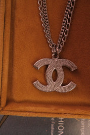 Rare vintage Chanel silver CC logo necklace, collectible designer statement piece