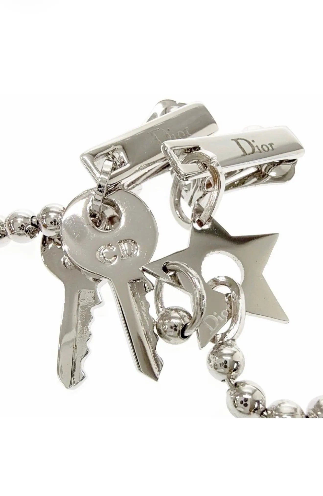 Vintage Christian Dior silver-tone star charm clip-on earring detail
