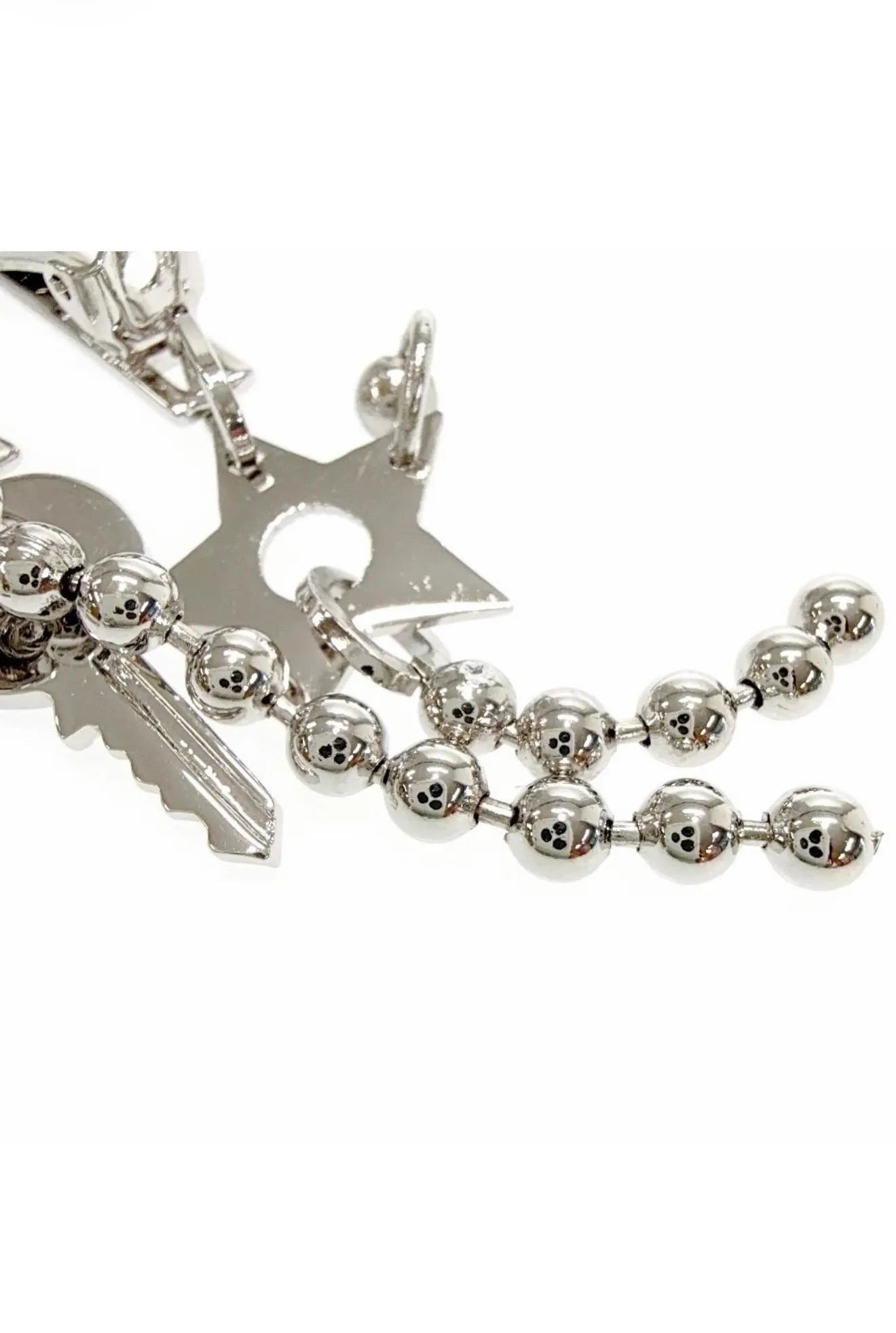 Vintage Christian Dior silver-tone key charm clip-on earring detail