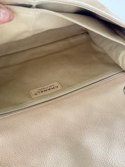 Vintage classic Chanel shoulder bag in caviar beige, made in France, with large front pockets, luxury designer handbag