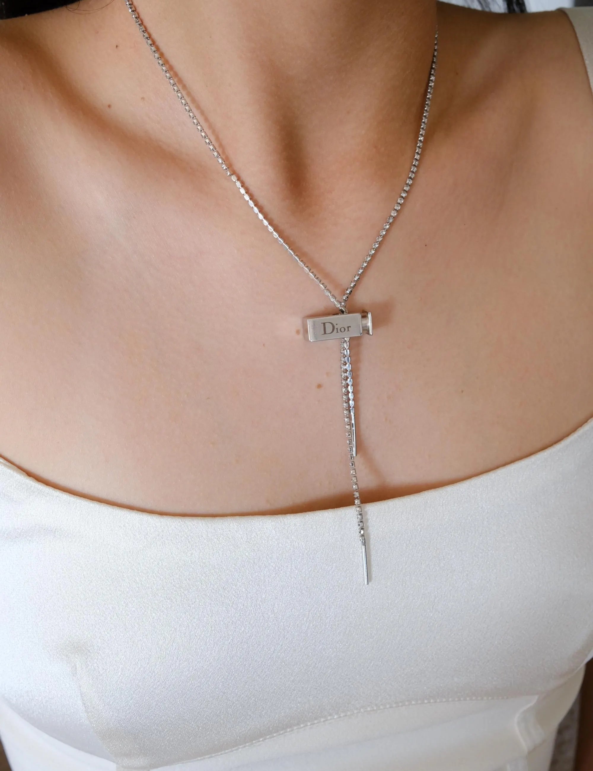 Vintage Christian Dior designer silver tone logo charm necklace from the Galliano era, elegant luxury fashion jewelry for women who love vintage accessories