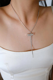 Vintage Christian Dior designer silver tone logo charm necklace from the Galliano era, elegant luxury fashion jewelry for women who love vintage accessories