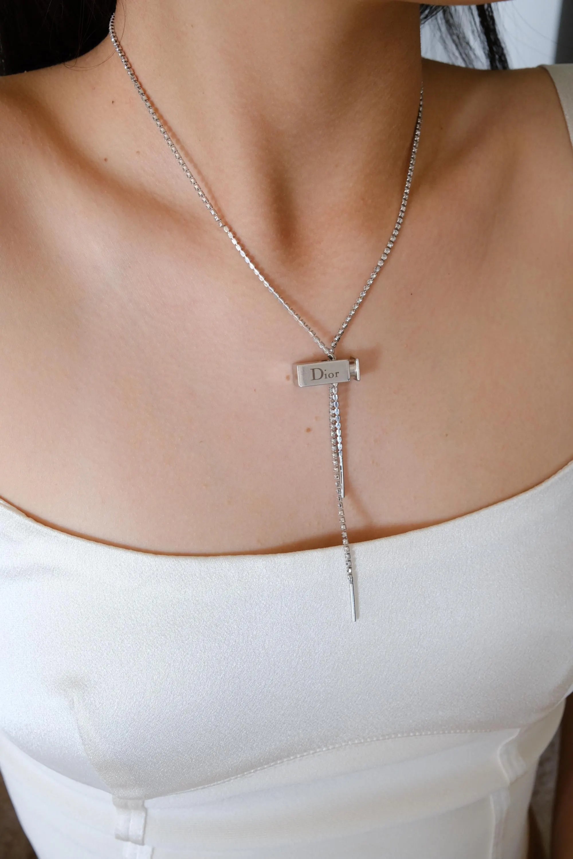 Vintage Christian Dior designer silver tone logo charm necklace from the Galliano era, elegant luxury fashion jewelry for women who love vintage accessories