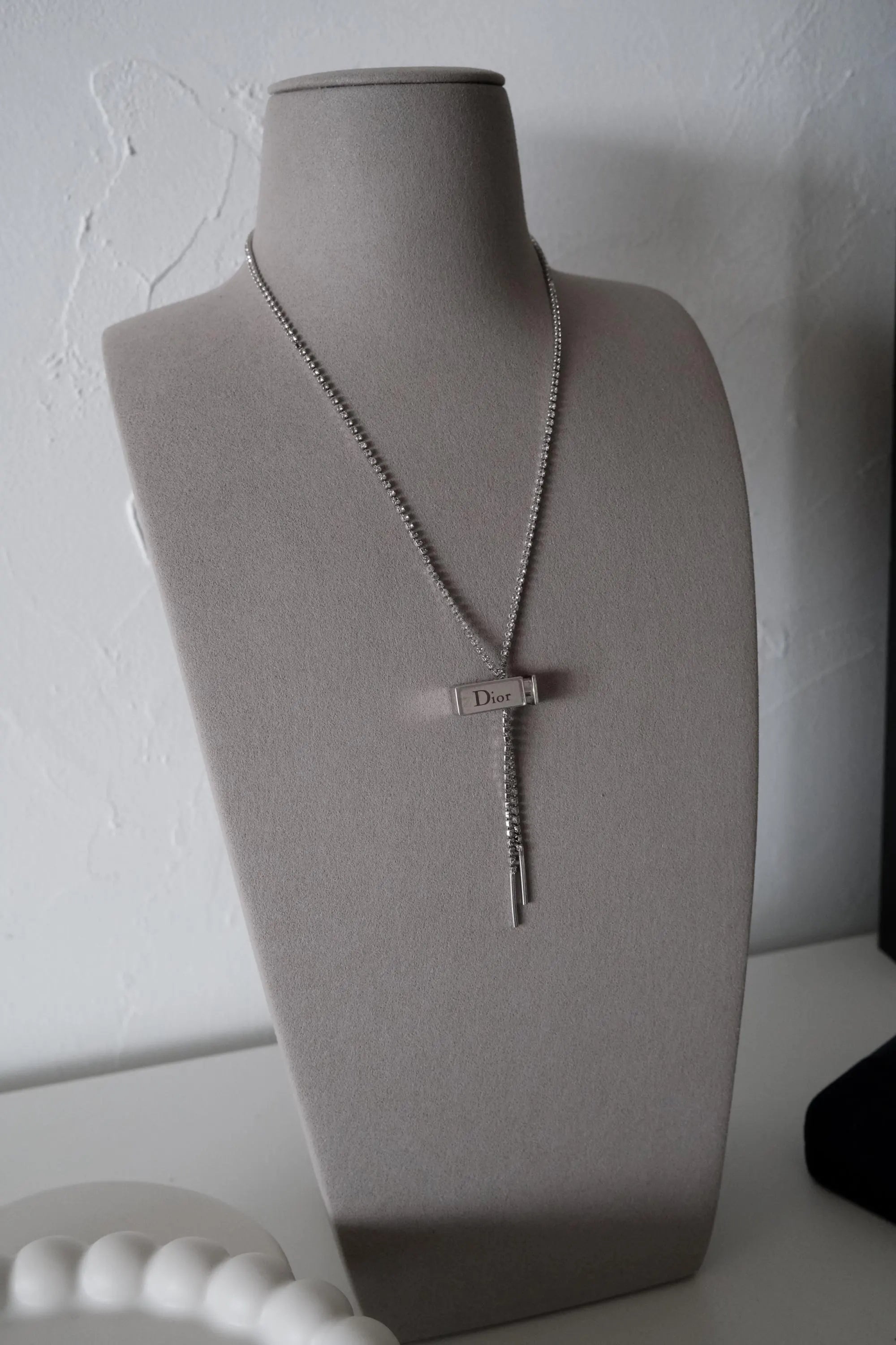 Vintage Christian Dior designer silver tone logo charm necklace from the Galliano era, elegant luxury fashion jewelry for women who love vintage accessories