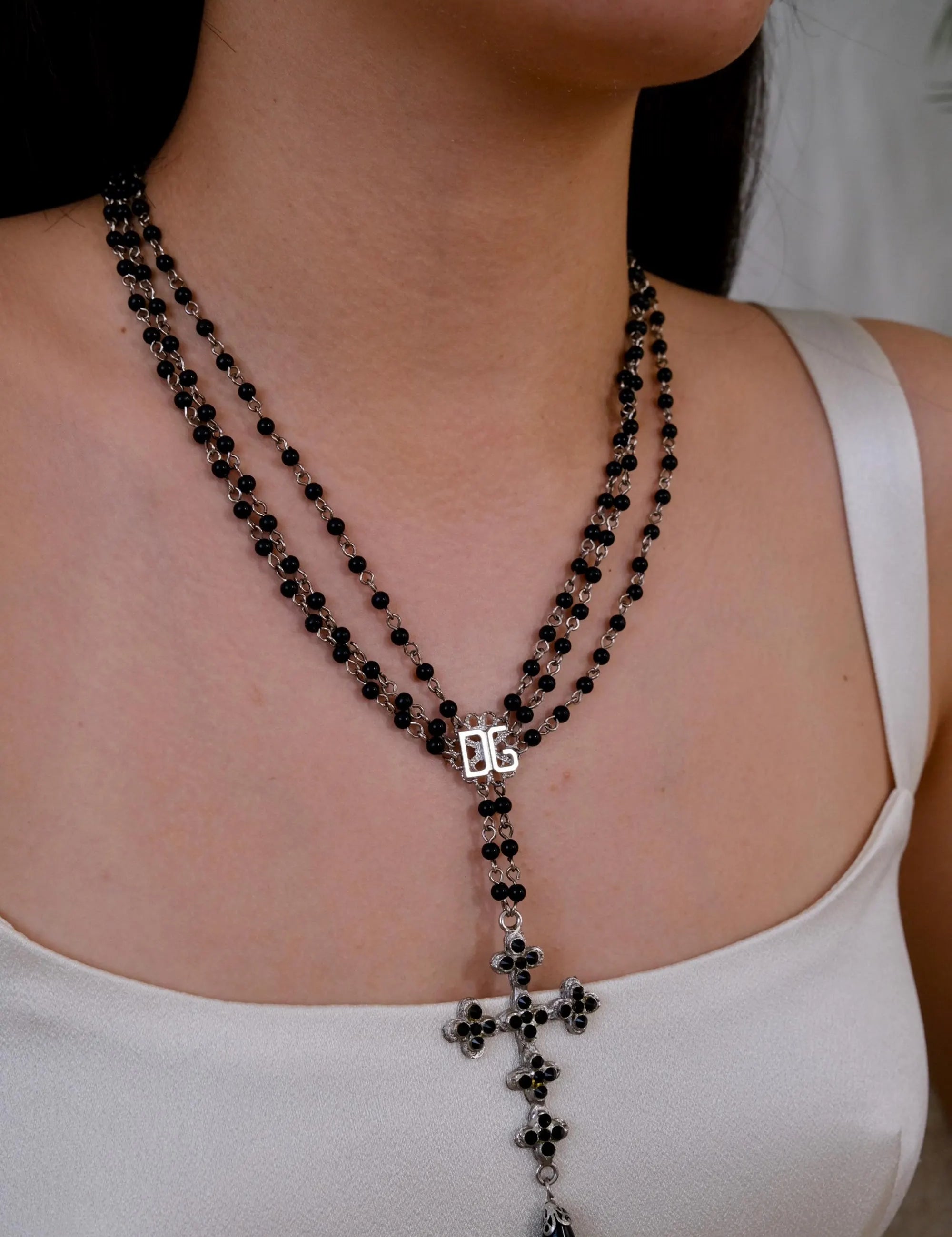 Vintage Dolce & Gabbana black bead cross necklace with silver tone pendant