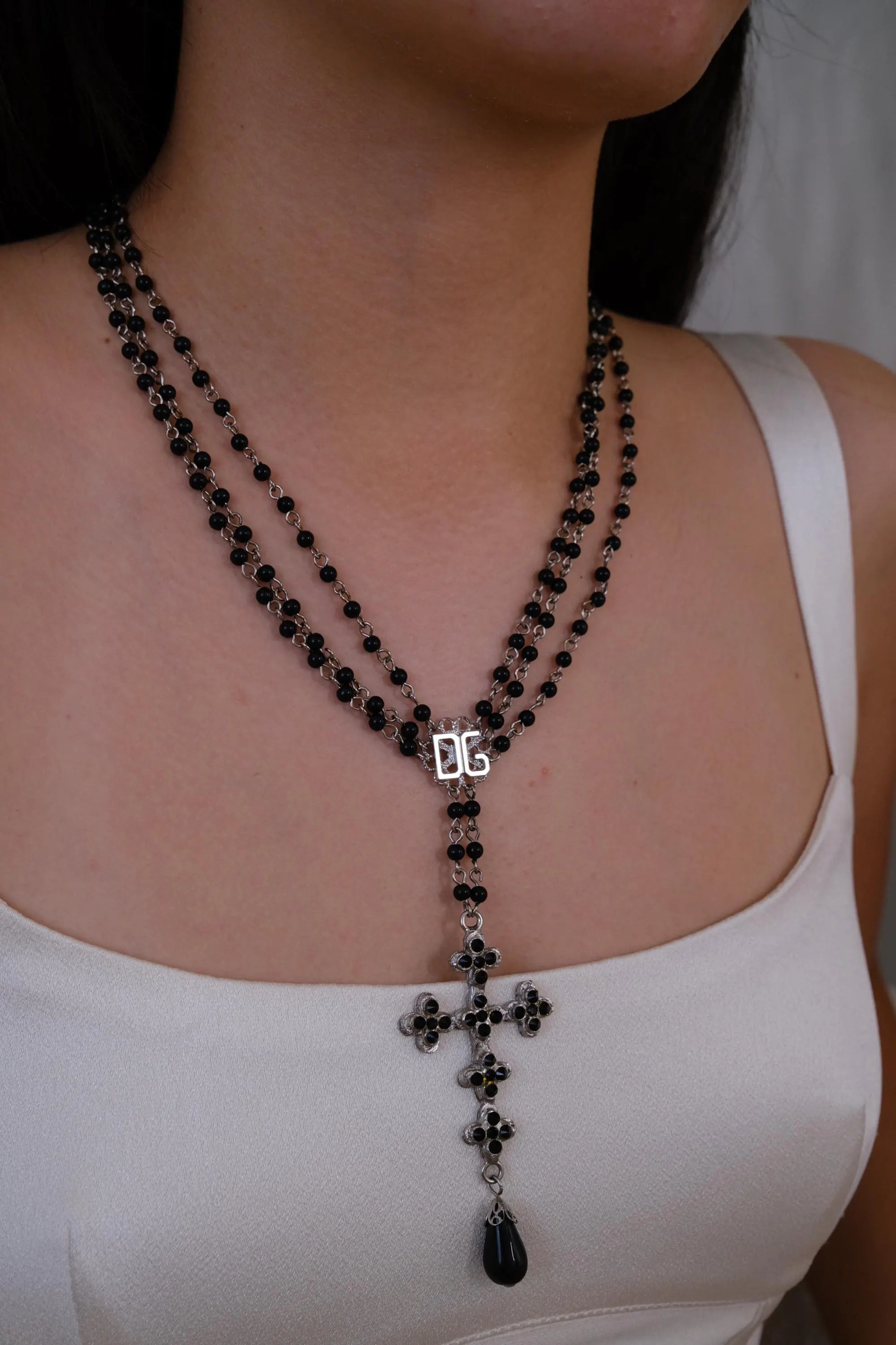 Vintage Dolce & Gabbana black bead cross necklace with silver tone pendant
