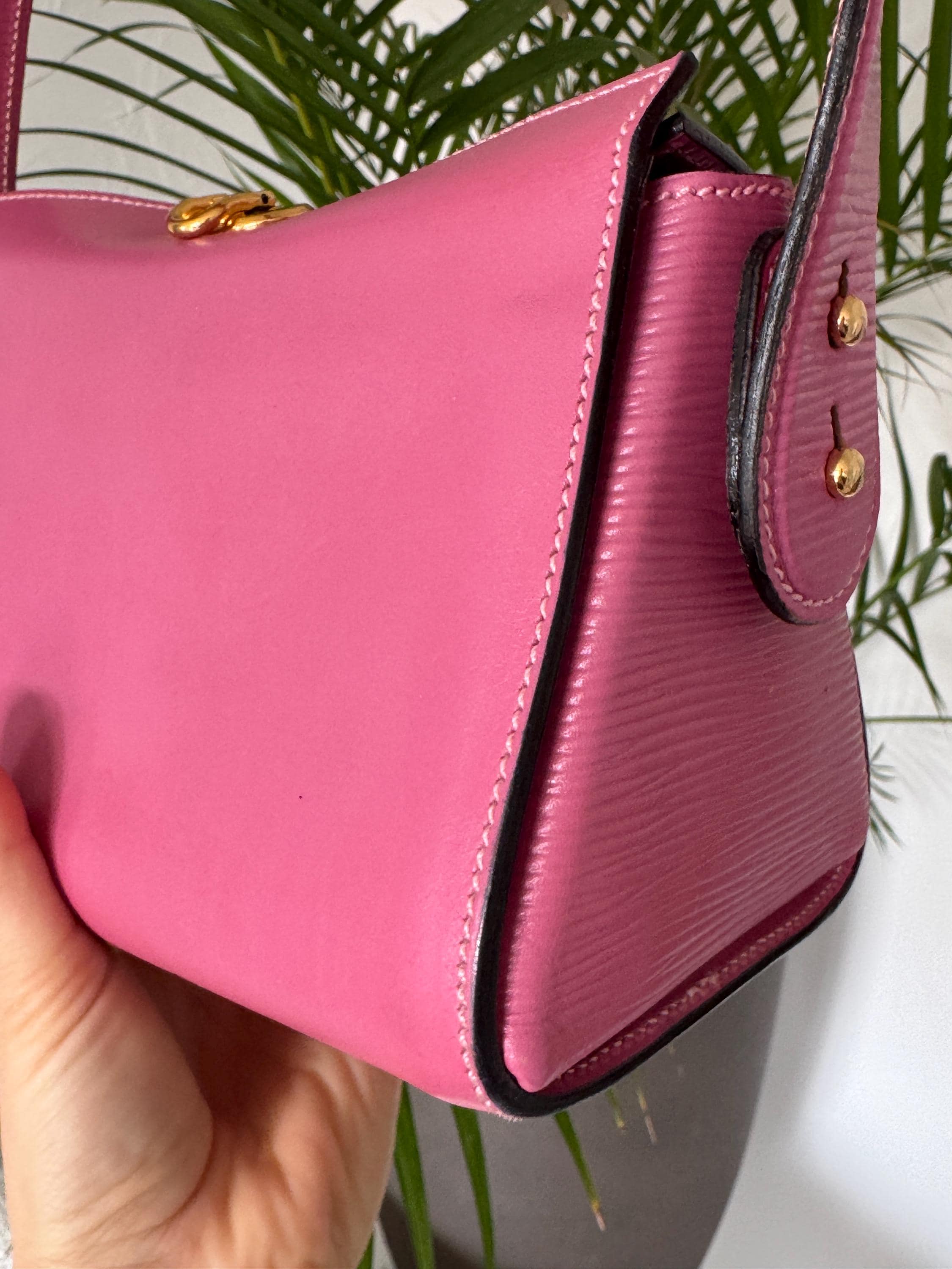 Elegant vintage Fendi pink leather handbag with structured top handle, timeless Italian designer luxury