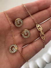 Vintage Givenchy crystal rhinestone necklace and earrings worn as gold tone statement jewelry
