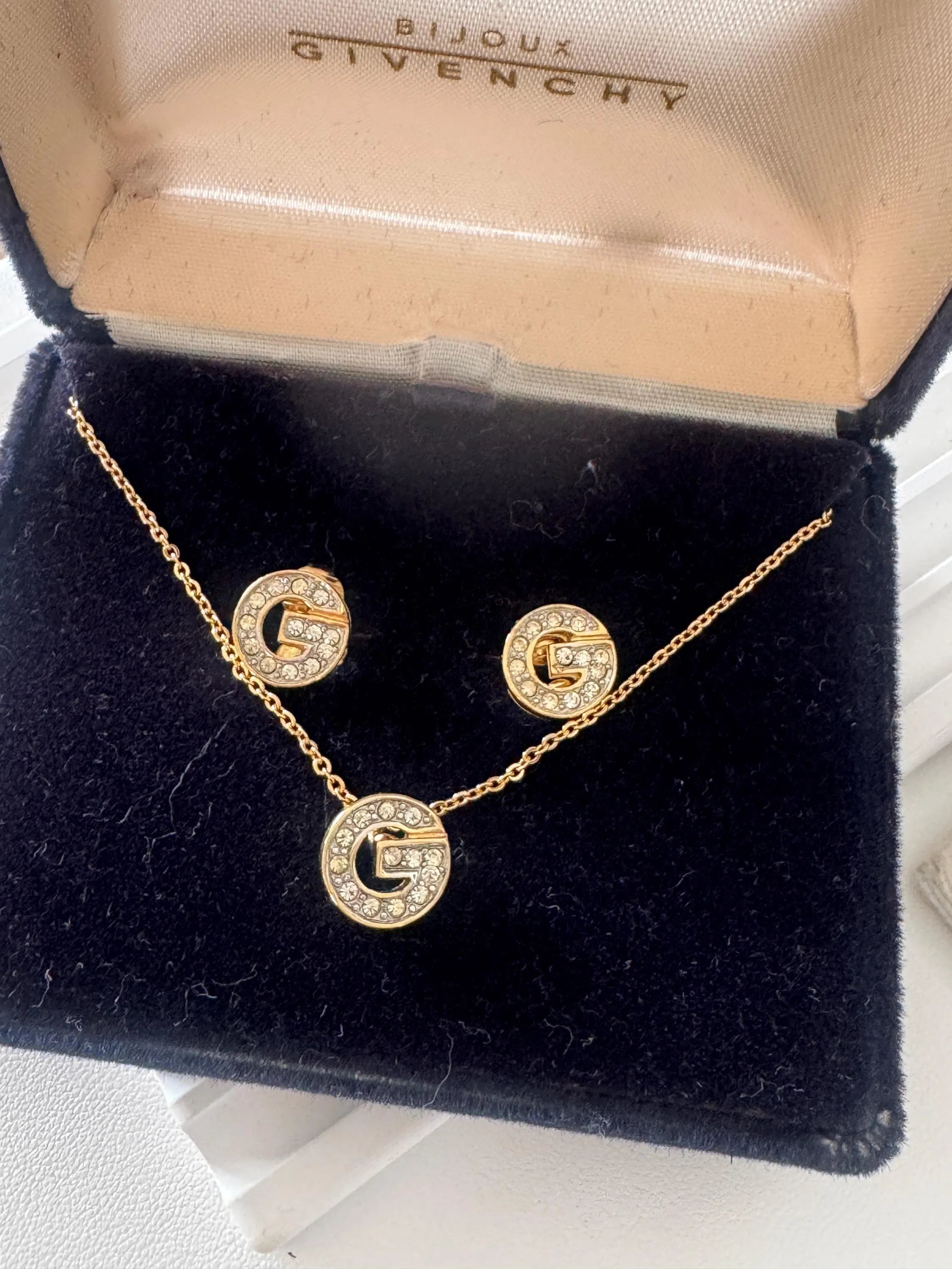 Vintage Givenchy gold tone G logo necklace and earrings set with crystal rhinestones