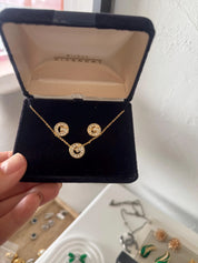 Vintage Givenchy gold tone G logo necklace and earrings set with crystal rhinestones