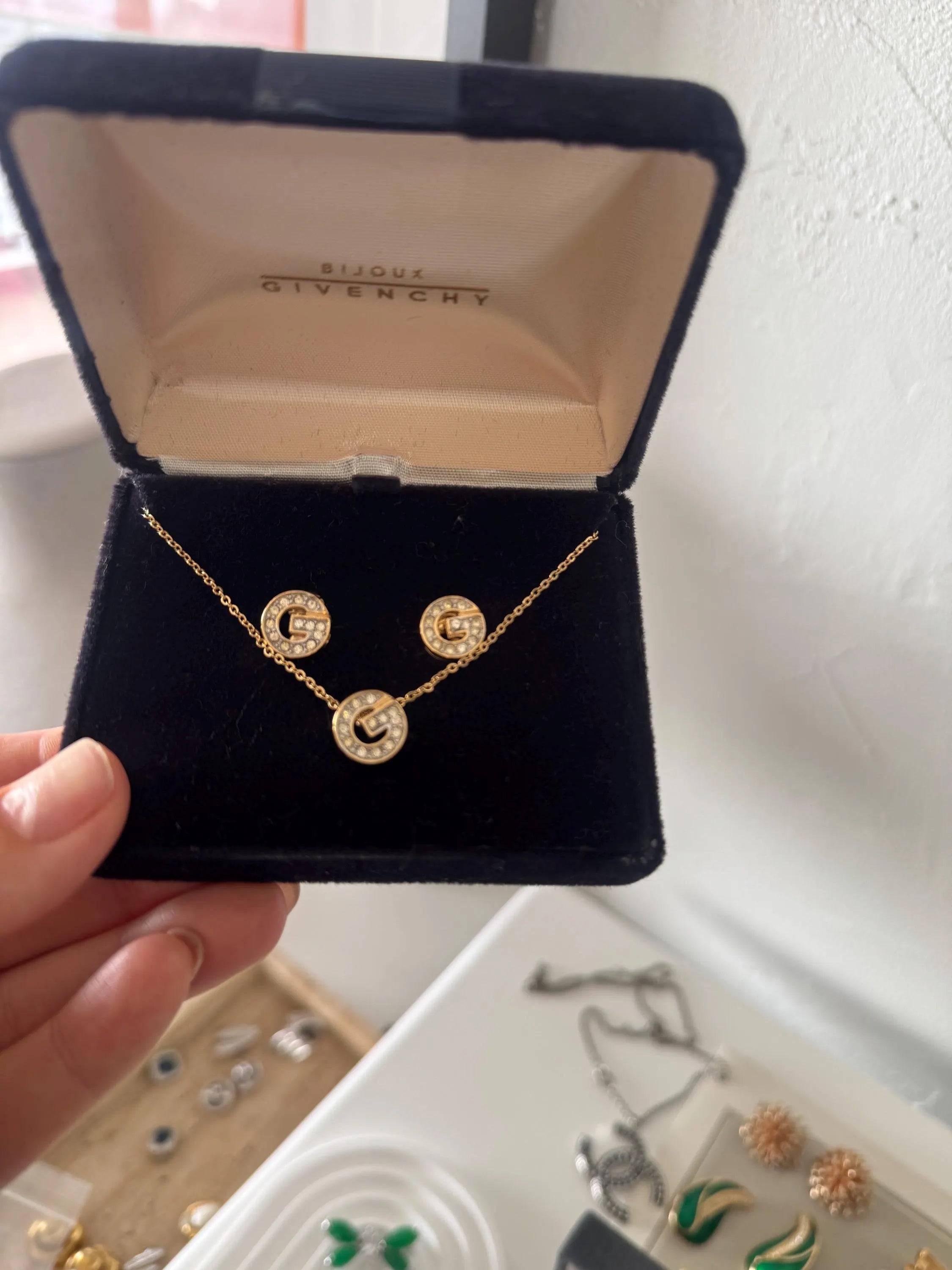 Vintage Givenchy gold tone G logo necklace and earrings set with crystal rhinestones