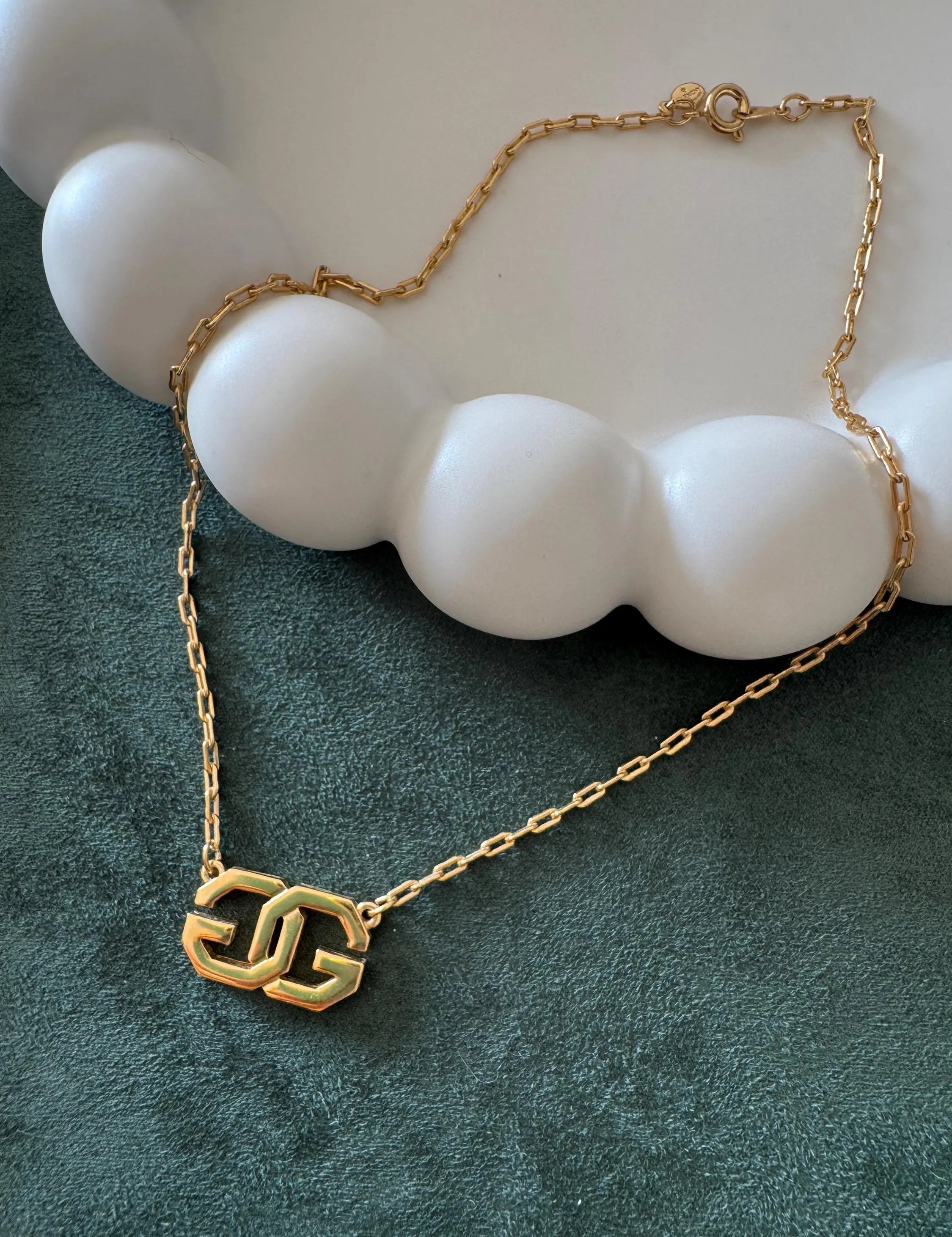 Vintage Givenchy gold tone G logo choker necklace, elegant designer statement jewelry for sophisticated women