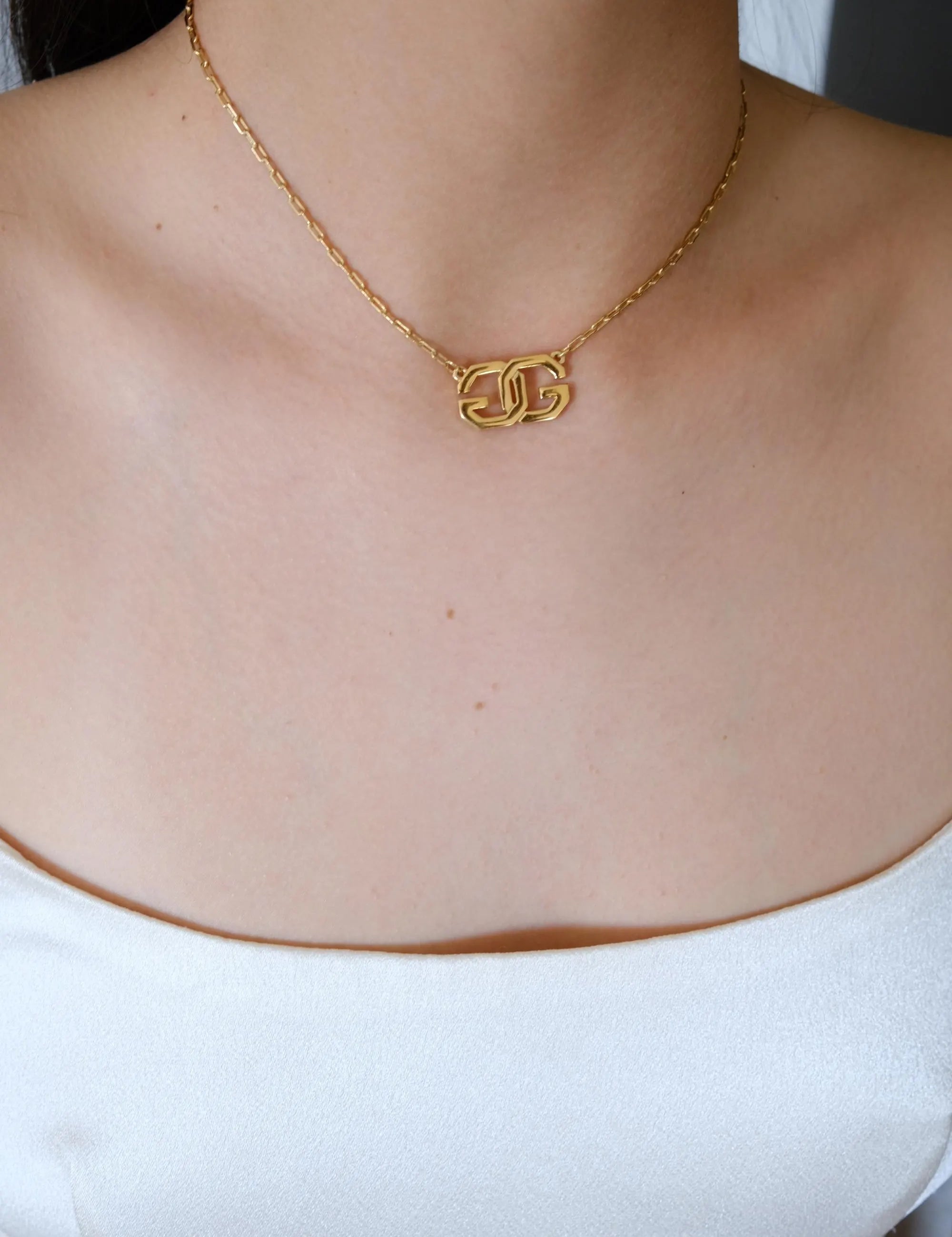 Rare vintage Givenchy gold tone G logo choker, collectible designer necklace with timeless elegance