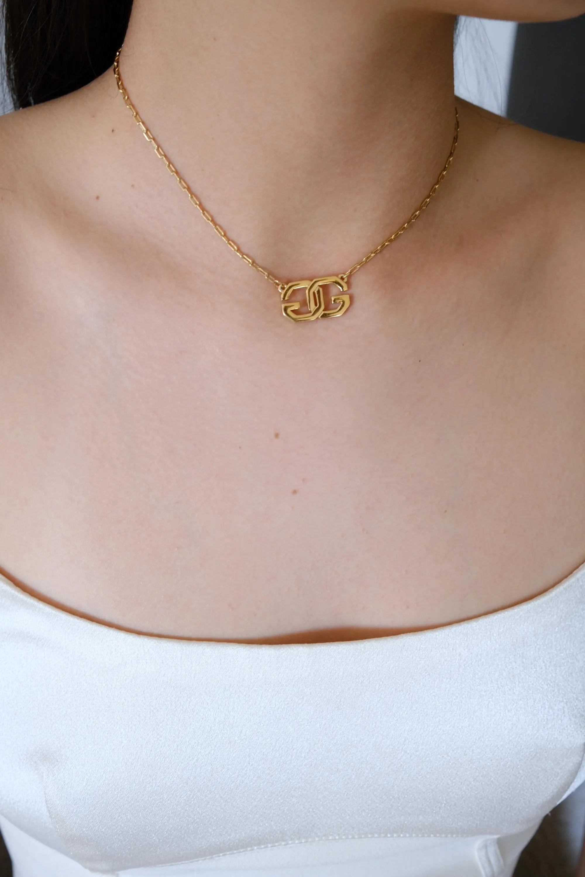 Rare vintage Givenchy gold tone G logo choker, collectible designer necklace with timeless elegance
