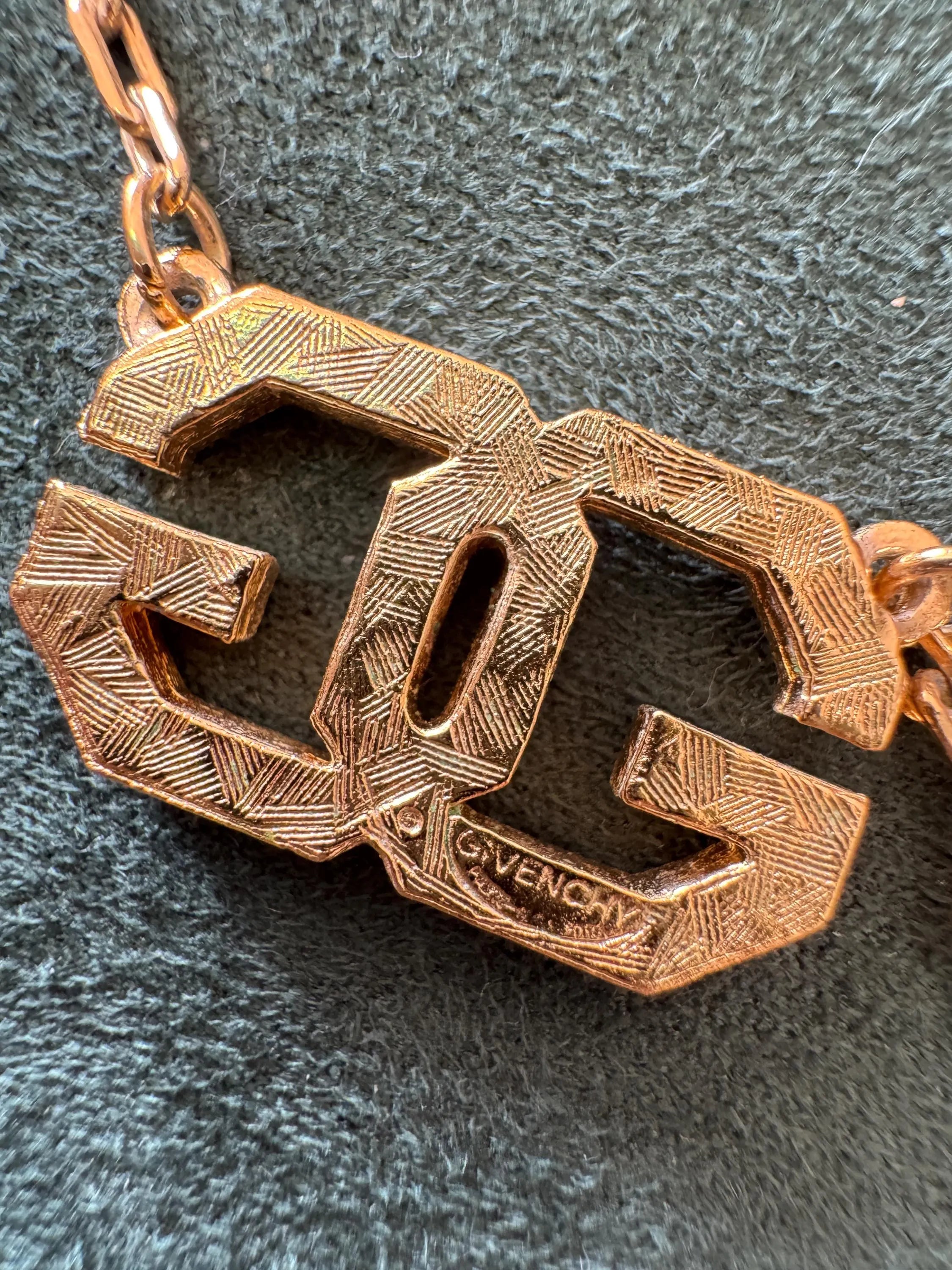 Elegant vintage Givenchy choker necklace in gold tone, iconic G logo and timeless European designer style
