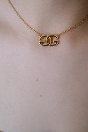 Vintage Givenchy gold tone G logo choker necklace, refined Parisian designer jewelry with timeless elegance