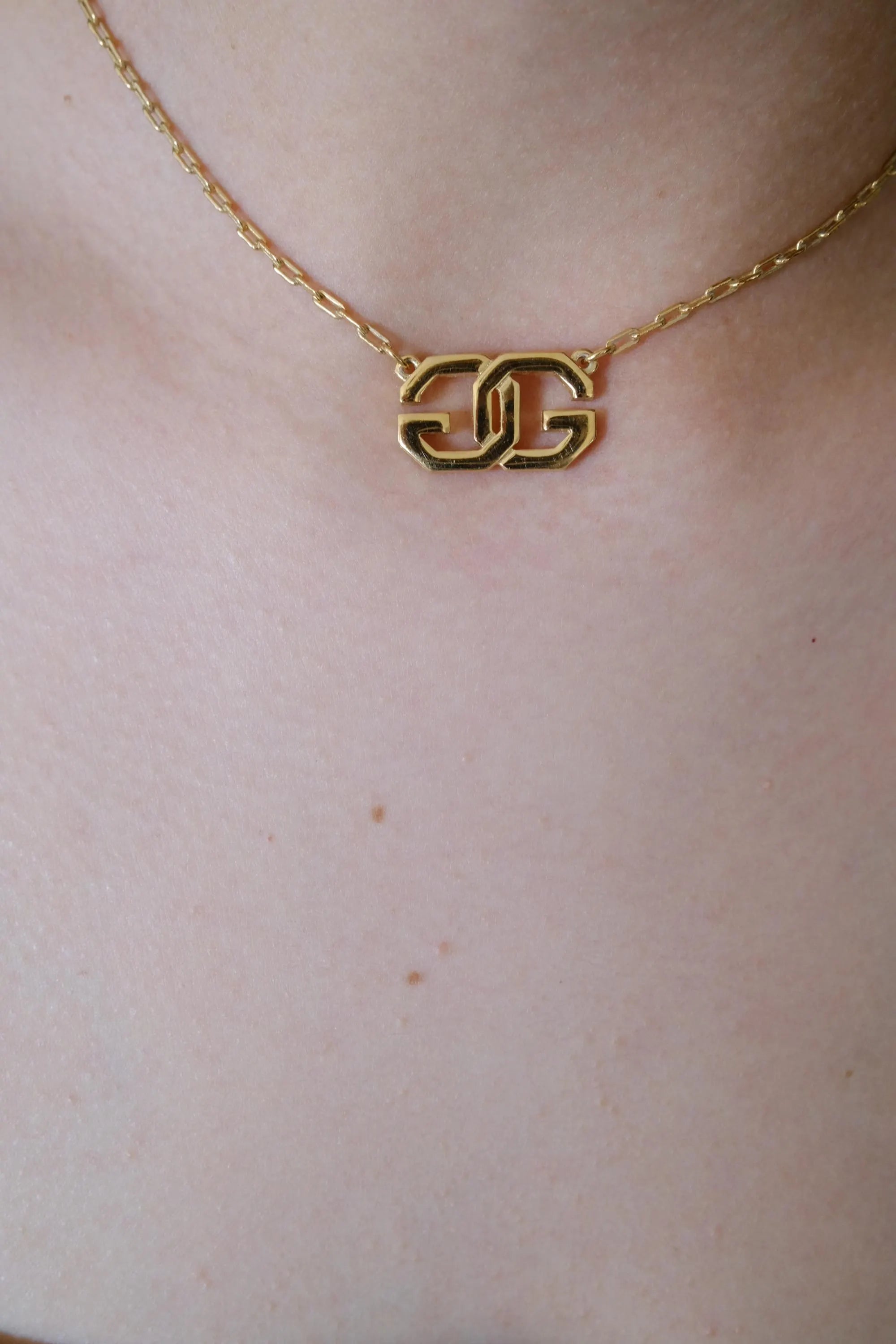 Vintage Givenchy gold tone G logo choker necklace, refined Parisian designer jewelry with timeless elegance