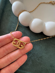 Elegant vintage Givenchy choker necklace in gold tone, iconic G logo and timeless European designer style