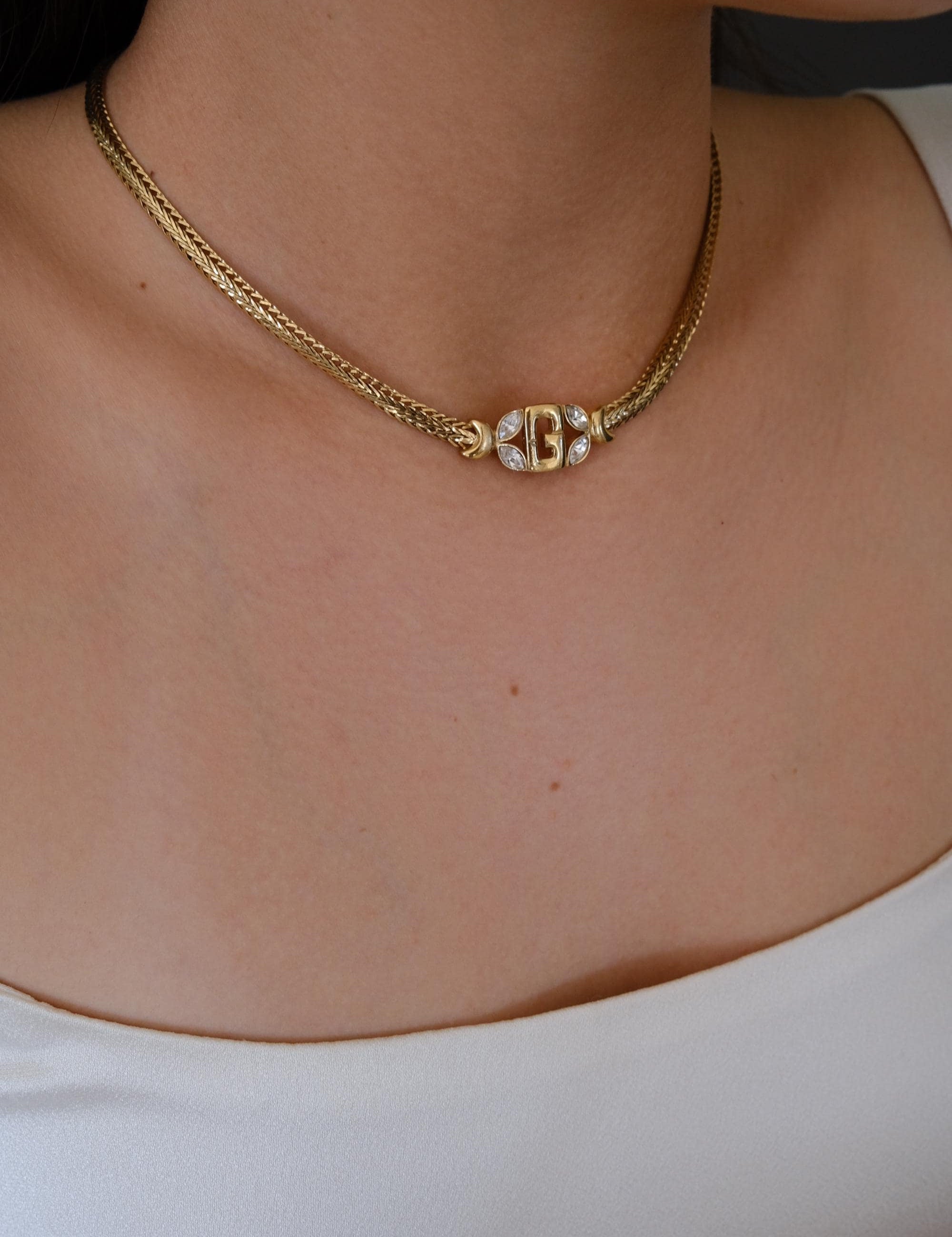 Vintage Givenchy gold tone G logo choker necklace, refined and timeless designer jewelry