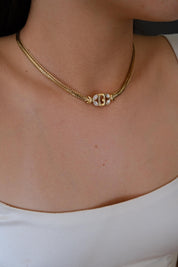 Vintage Givenchy gold tone G logo choker necklace, refined and timeless designer jewelry
