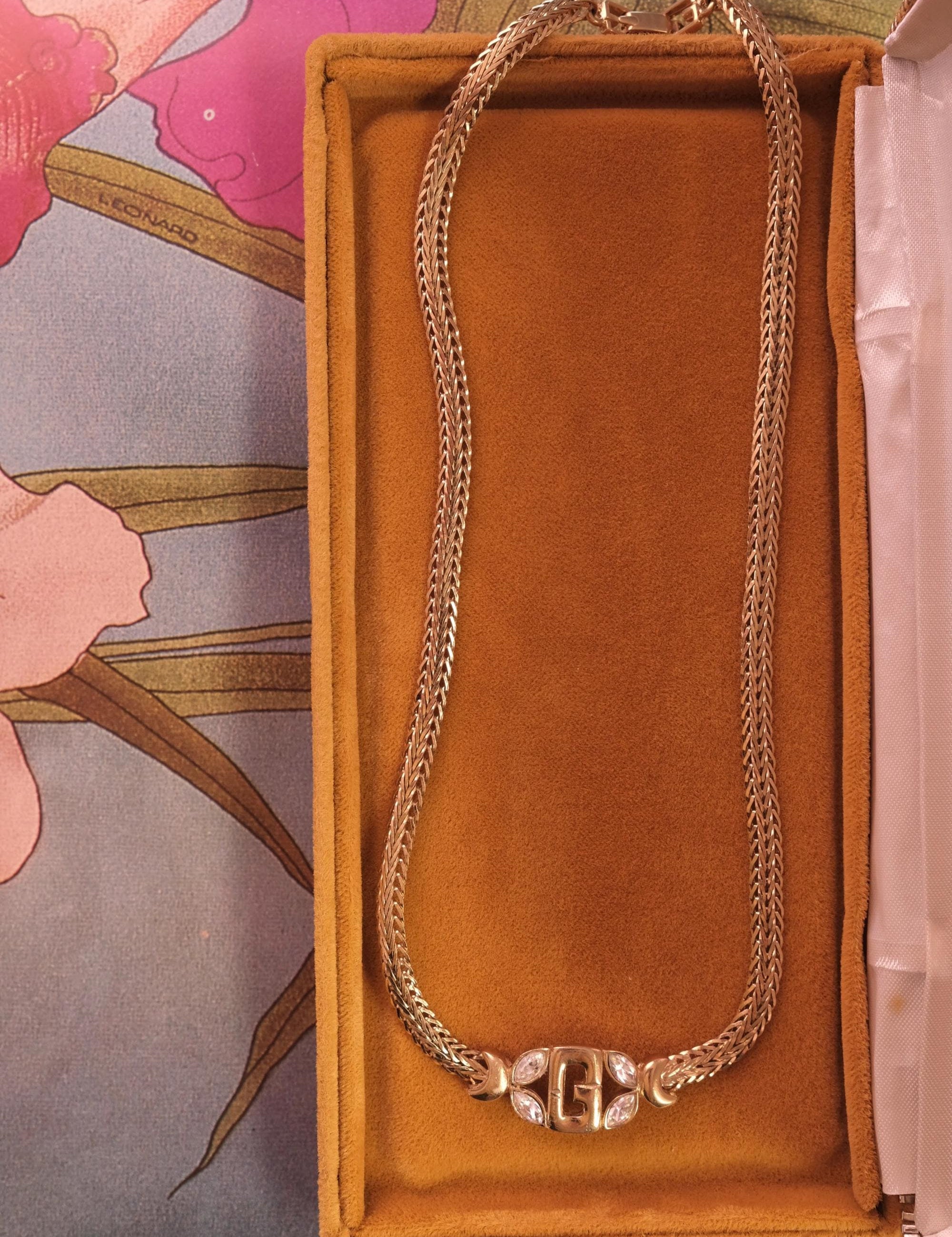 Elegant vintage Givenchy gold tone G logo necklace, minimalist designer piece with subtle crystal detail