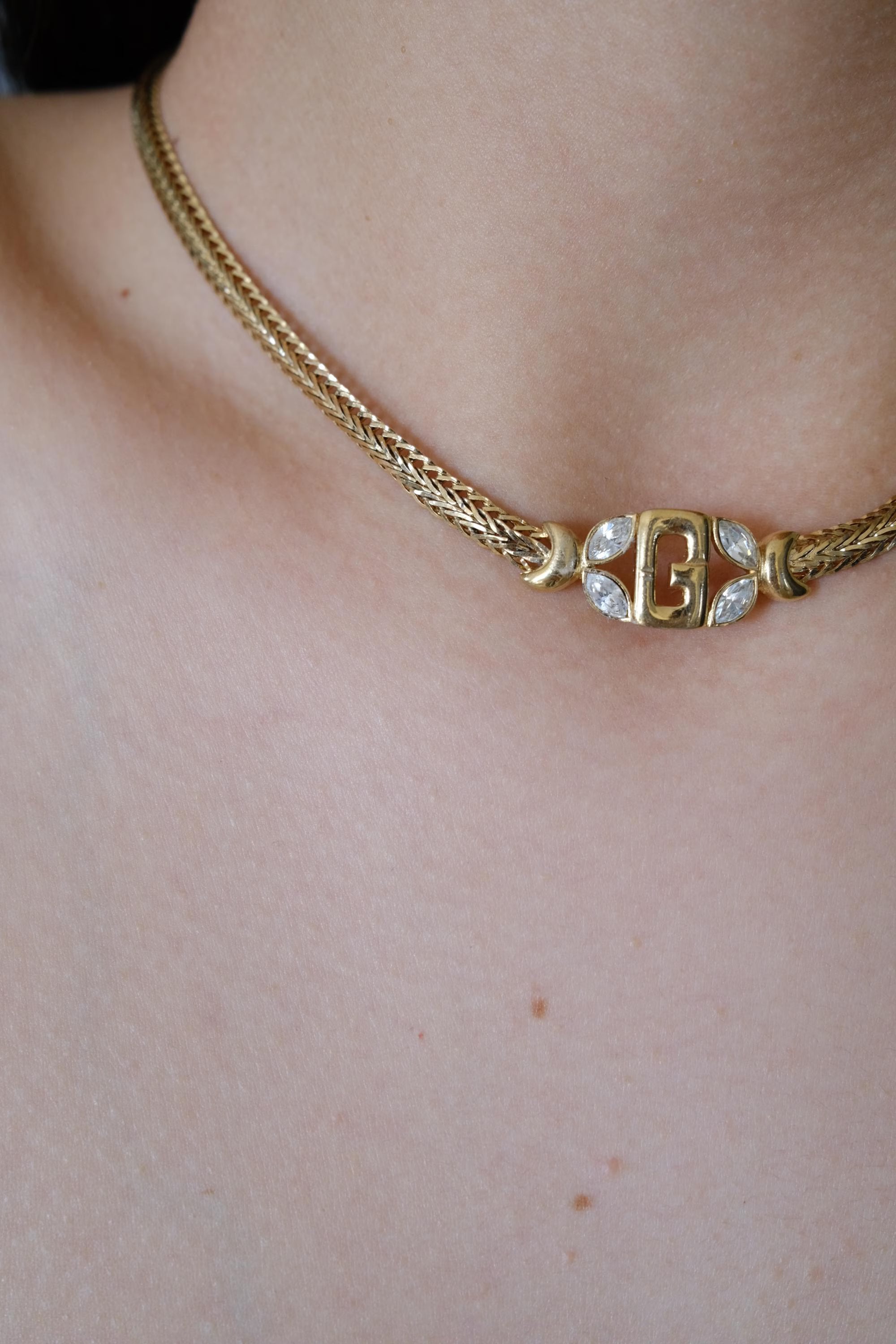 Vintage Givenchy G logo necklace in gold tone, understated and refined designer elegance