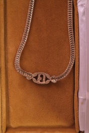 Vintage Givenchy G logo necklace in gold tone, refined designer piece with lasting investment appeal