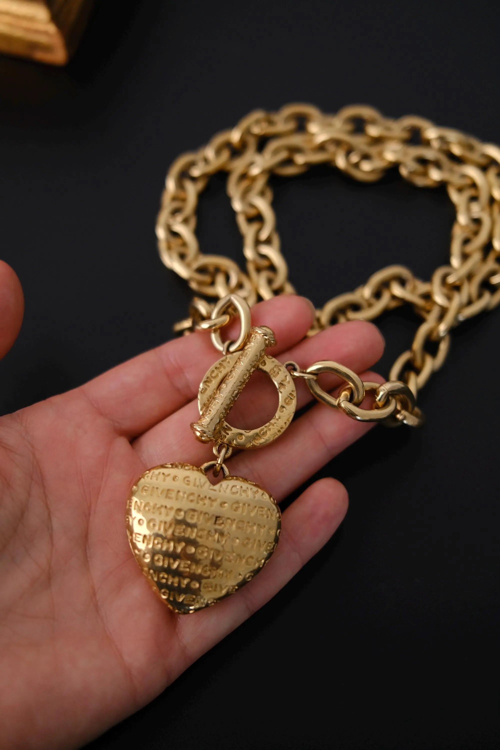 GIVENCHY embossed heart pendant detail on vintage gold-tone chain
