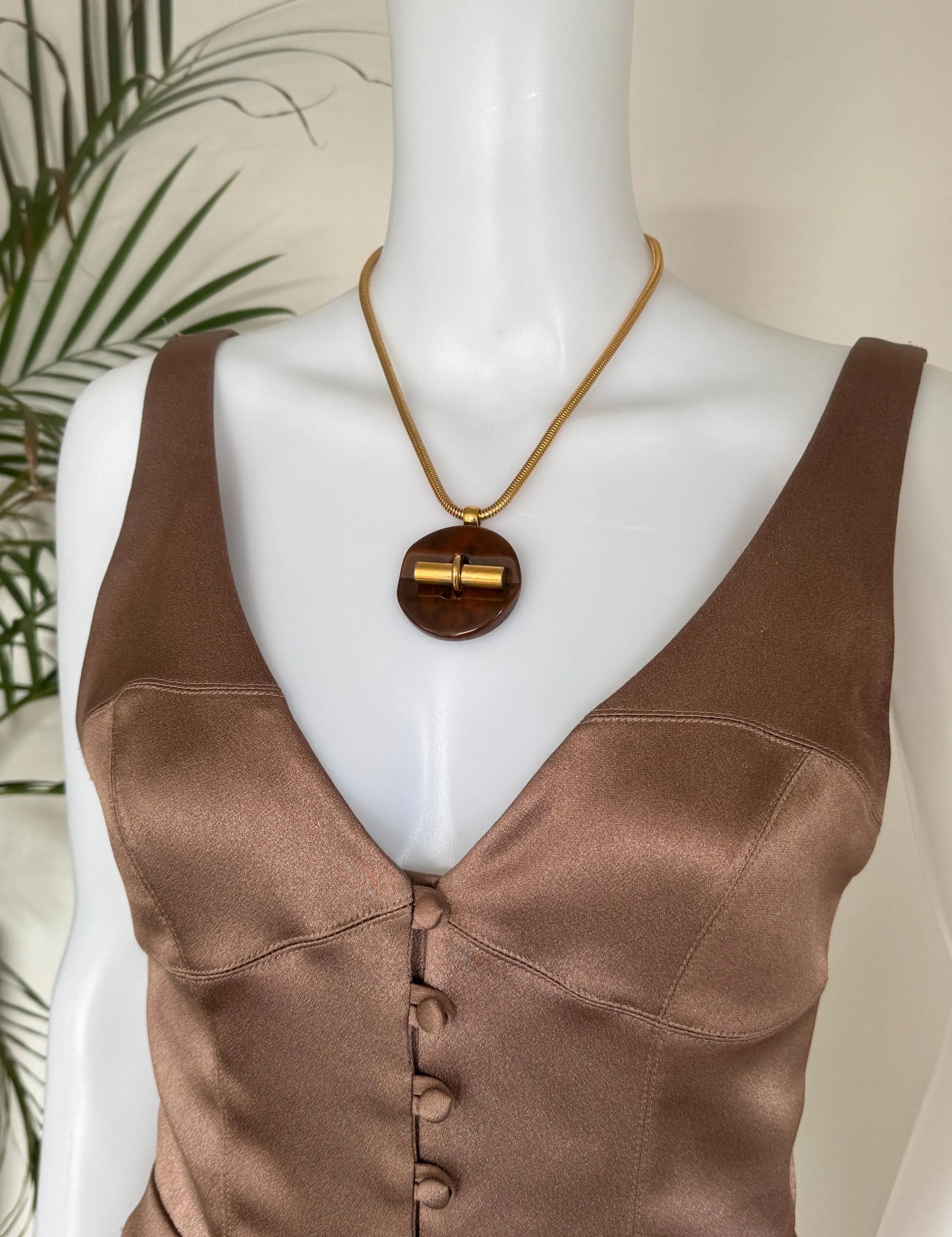 Vintage Givenchy designer necklace in gold tone snake chain, sophisticated statement pendant jewelry, perfect luxury gift for women