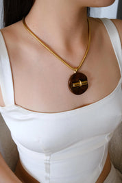 Vintage Givenchy designer necklace in gold tone snake chain, sophisticated statement pendant jewelry, perfect luxury gift for women
