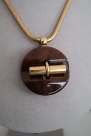 Vintage Givenchy gold tone snake chain necklace with sculptural pendant, elegant designer fashion jewelry and timeless luxury gift for women