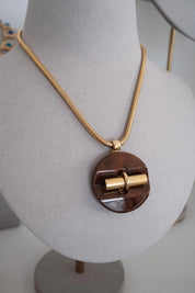 Vintage Givenchy gold tone snake chain necklace with sculptural pendant, elegant designer fashion jewelry and timeless luxury gift for women