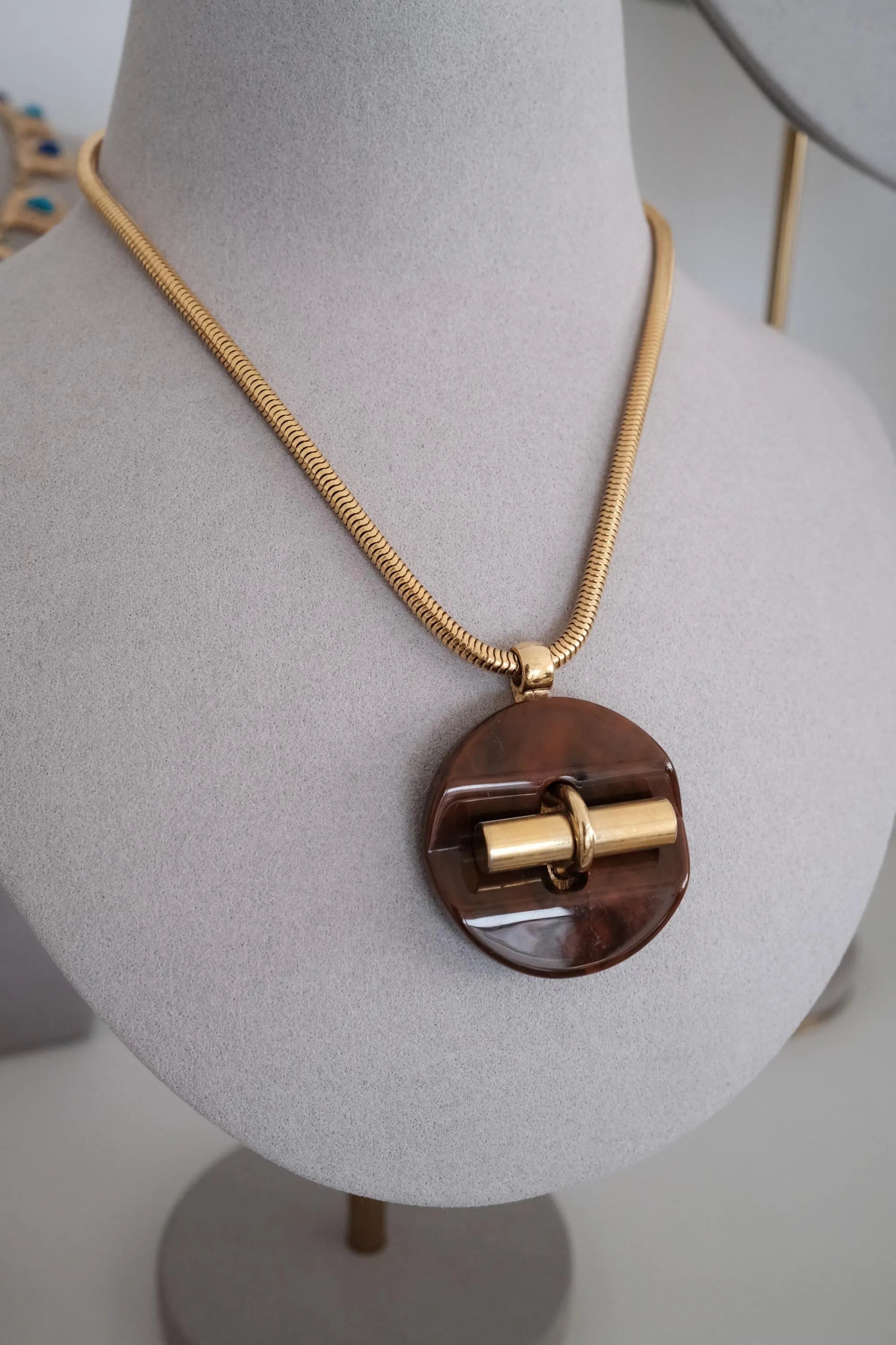 Vintage Givenchy gold tone snake chain necklace with sculptural pendant, elegant designer fashion jewelry and timeless luxury gift for women
