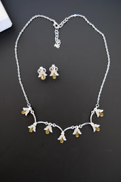Vintage Nina Ricci silver-tone necklace and matching clip-on earrings set with amber glass drops and clear crystals