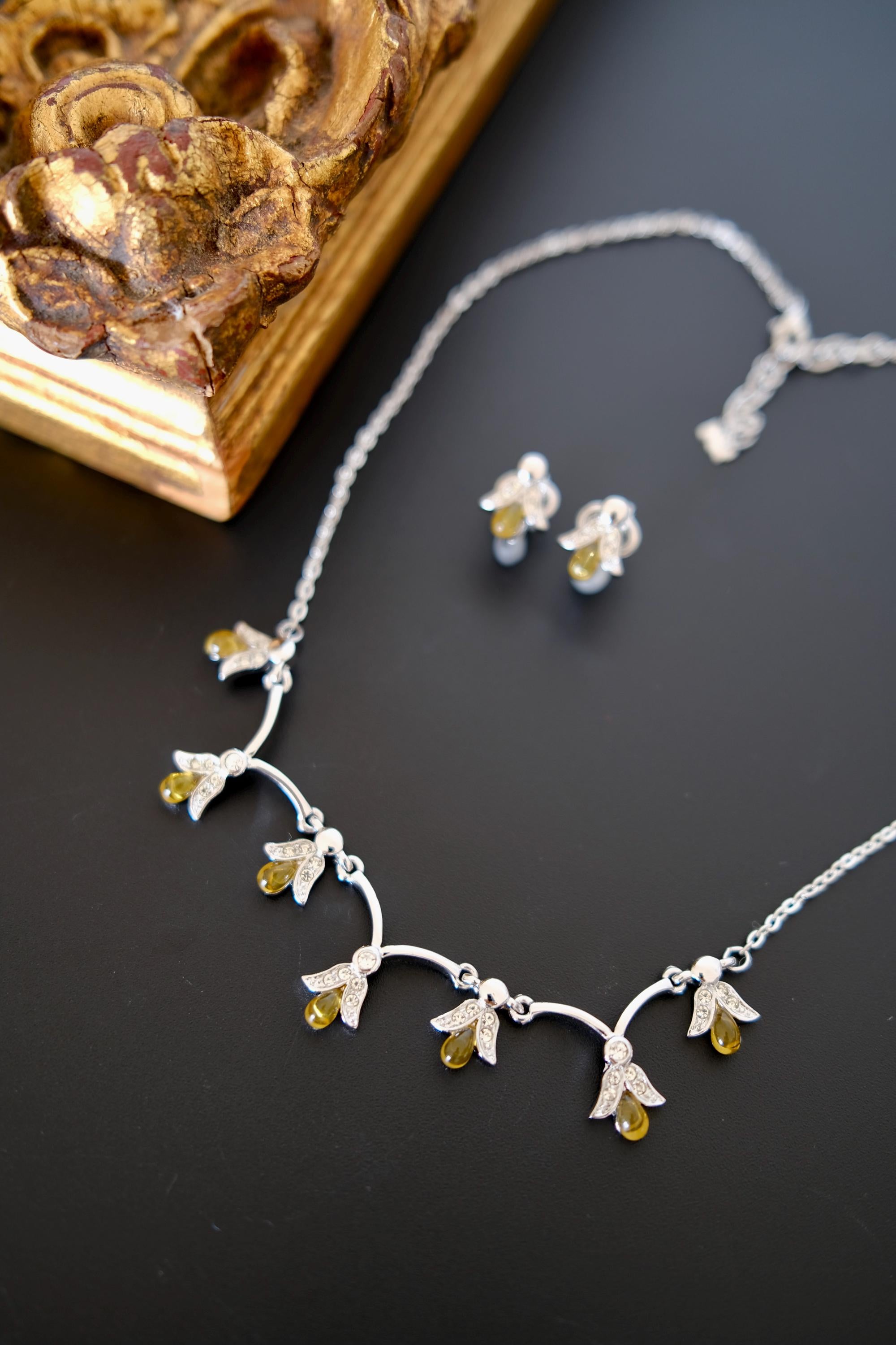 Vintage Nina Ricci amber glass and crystal necklace earrings set close-up