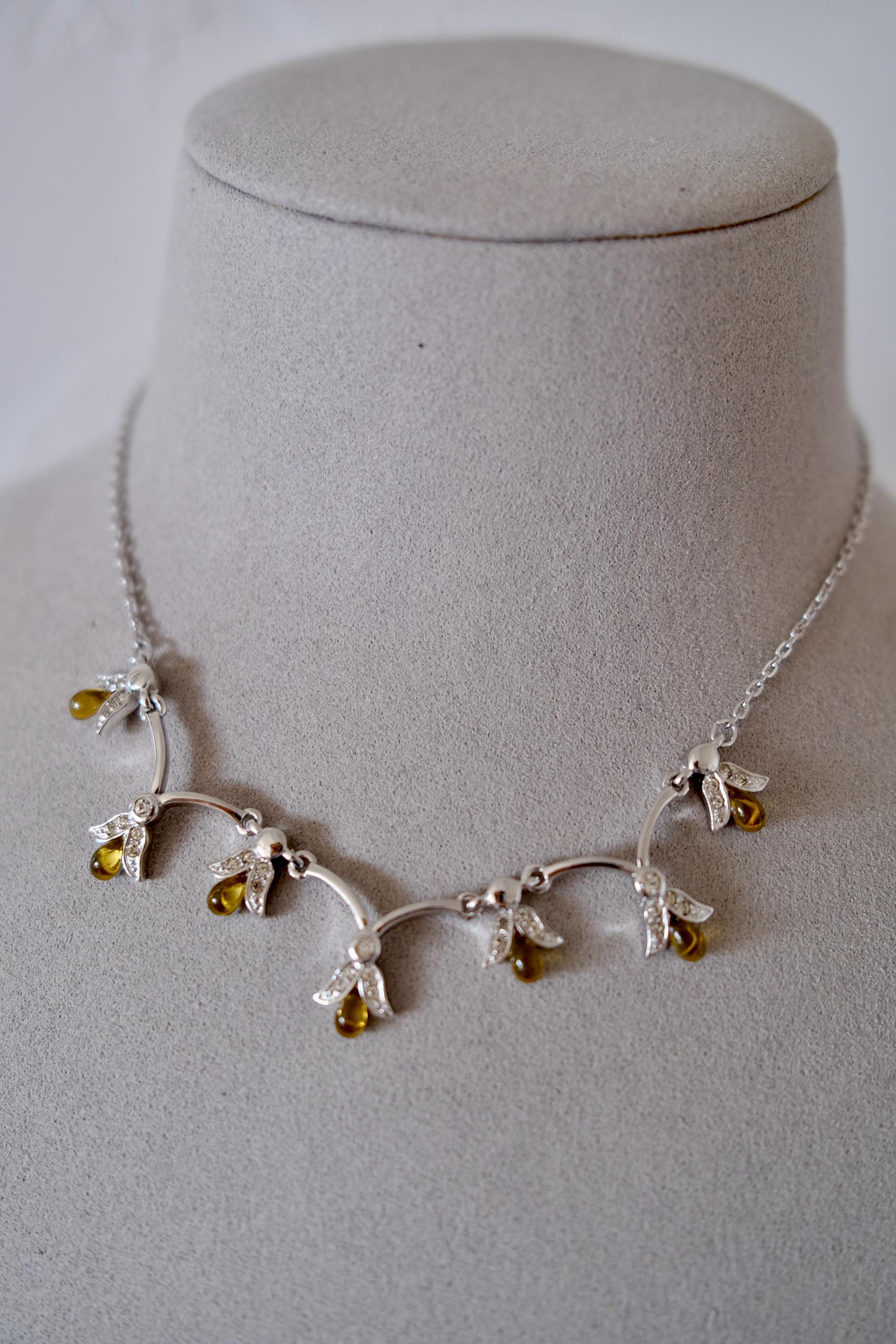 Vintage Nina Ricci silver-tone necklace and matching clip-on earrings set with amber glass drops and clear crystals