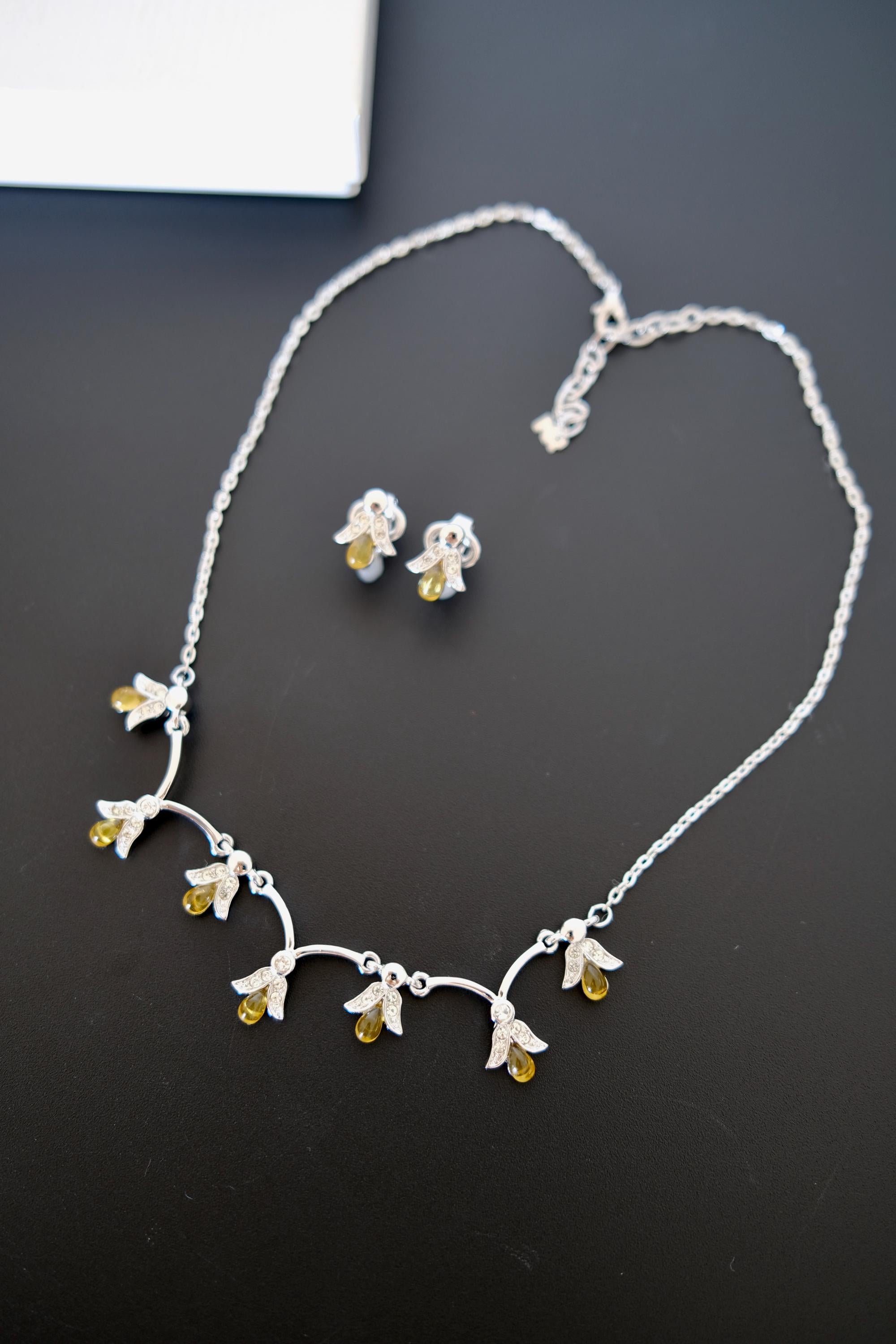 Vintage Nina Ricci silver-tone necklace and matching clip-on earrings set with amber glass drops and clear crystals
