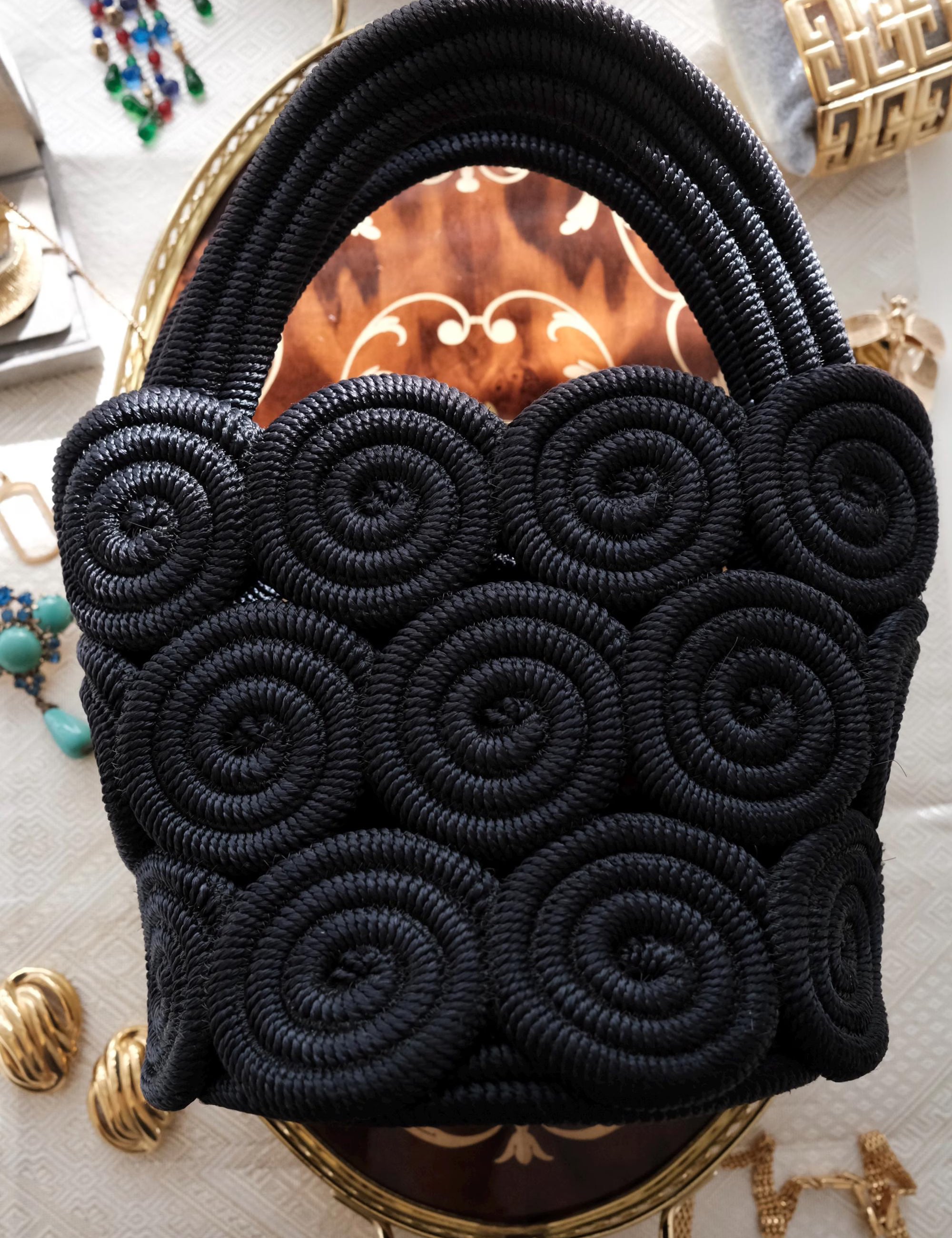 Vintage Nina Ricci handcrafted rope handbag, sculptural black design showcasing refined French craftsmanship