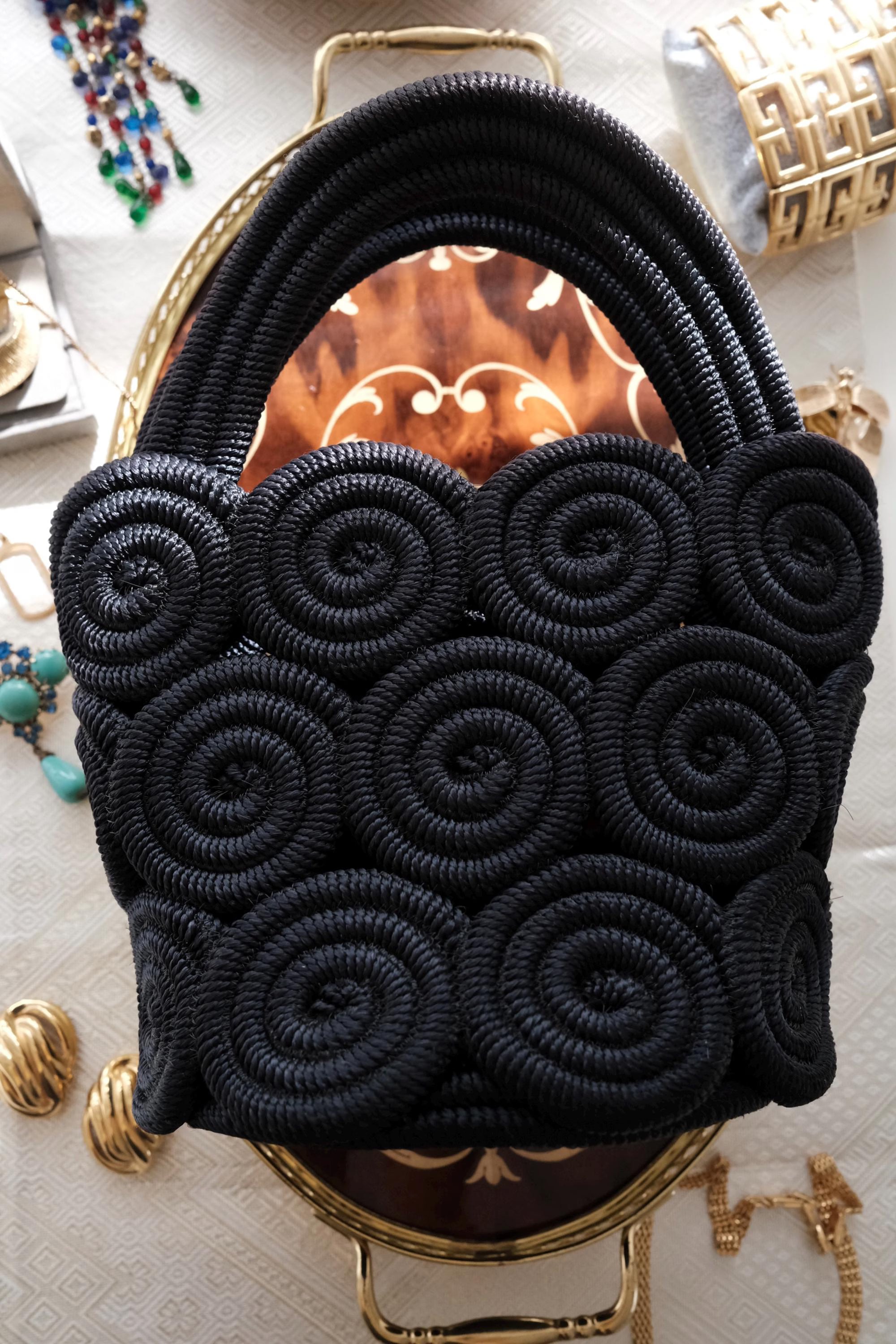 Vintage Nina Ricci handcrafted rope handbag, sculptural black design showcasing refined French craftsmanship