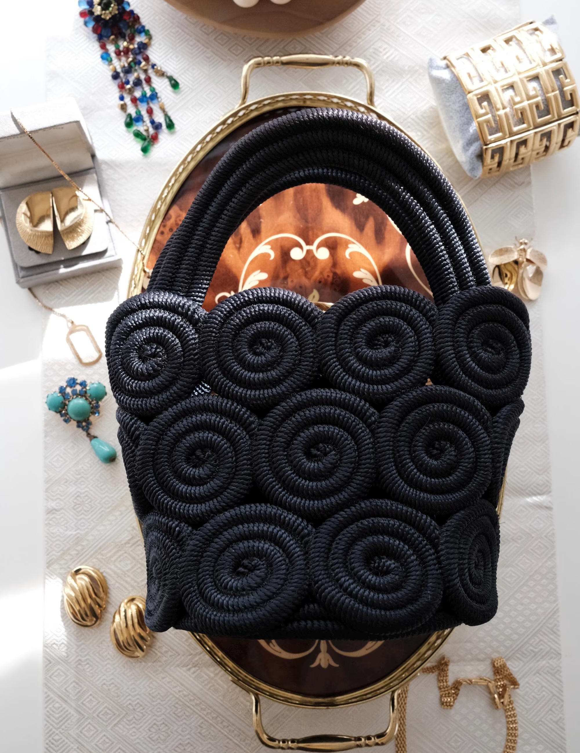Elegant vintage Nina Ricci black rope handbag, handcrafted sculptural form and timeless French designer style