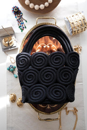 Elegant vintage Nina Ricci black rope handbag, handcrafted sculptural form and timeless French designer style