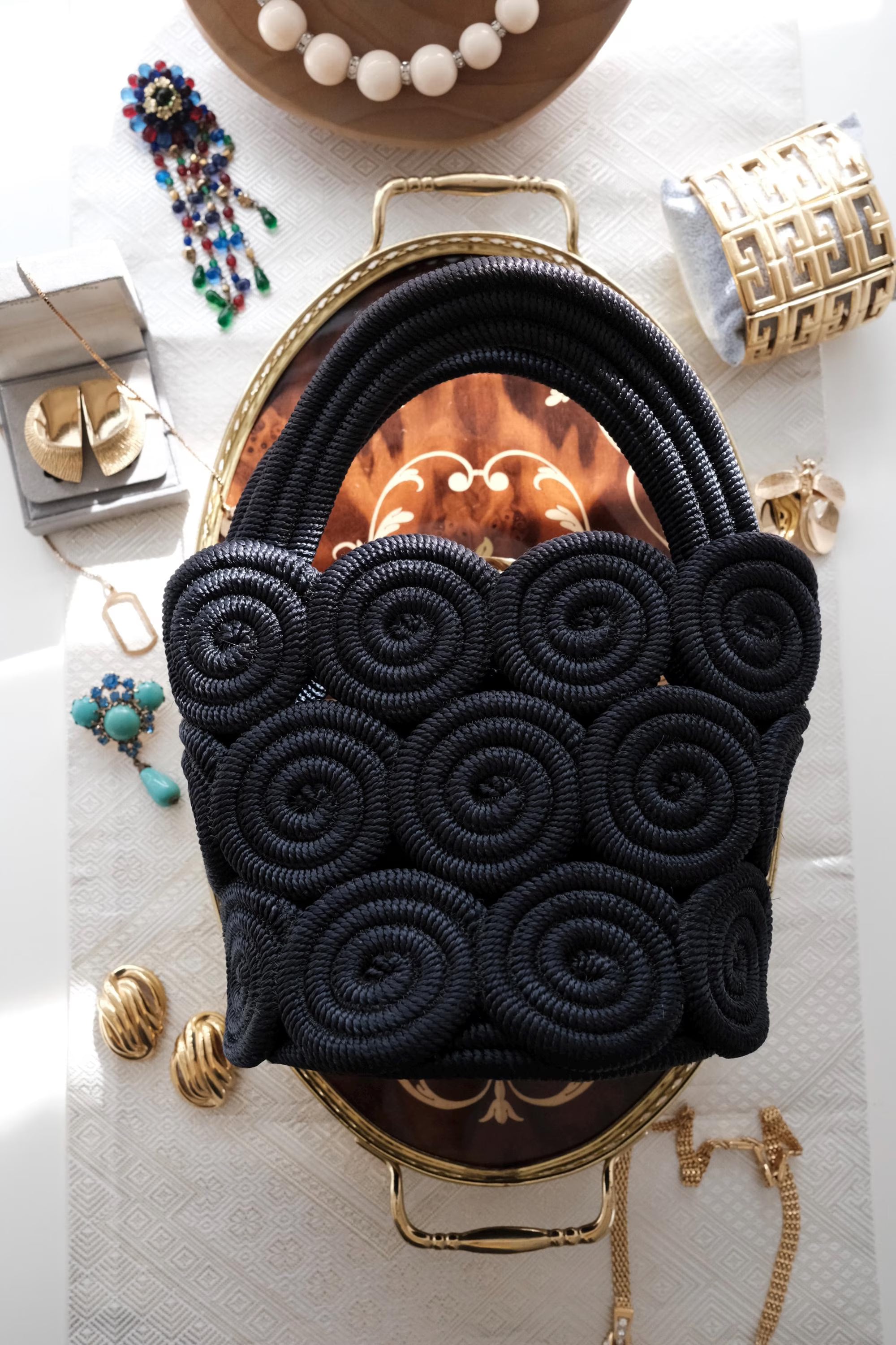 Elegant vintage Nina Ricci black rope handbag, handcrafted sculptural form and timeless French designer style