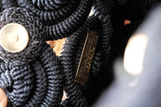 Vintage Nina Ricci sculptural rope handbag in black, handcrafted French designer bag with artistic elegance