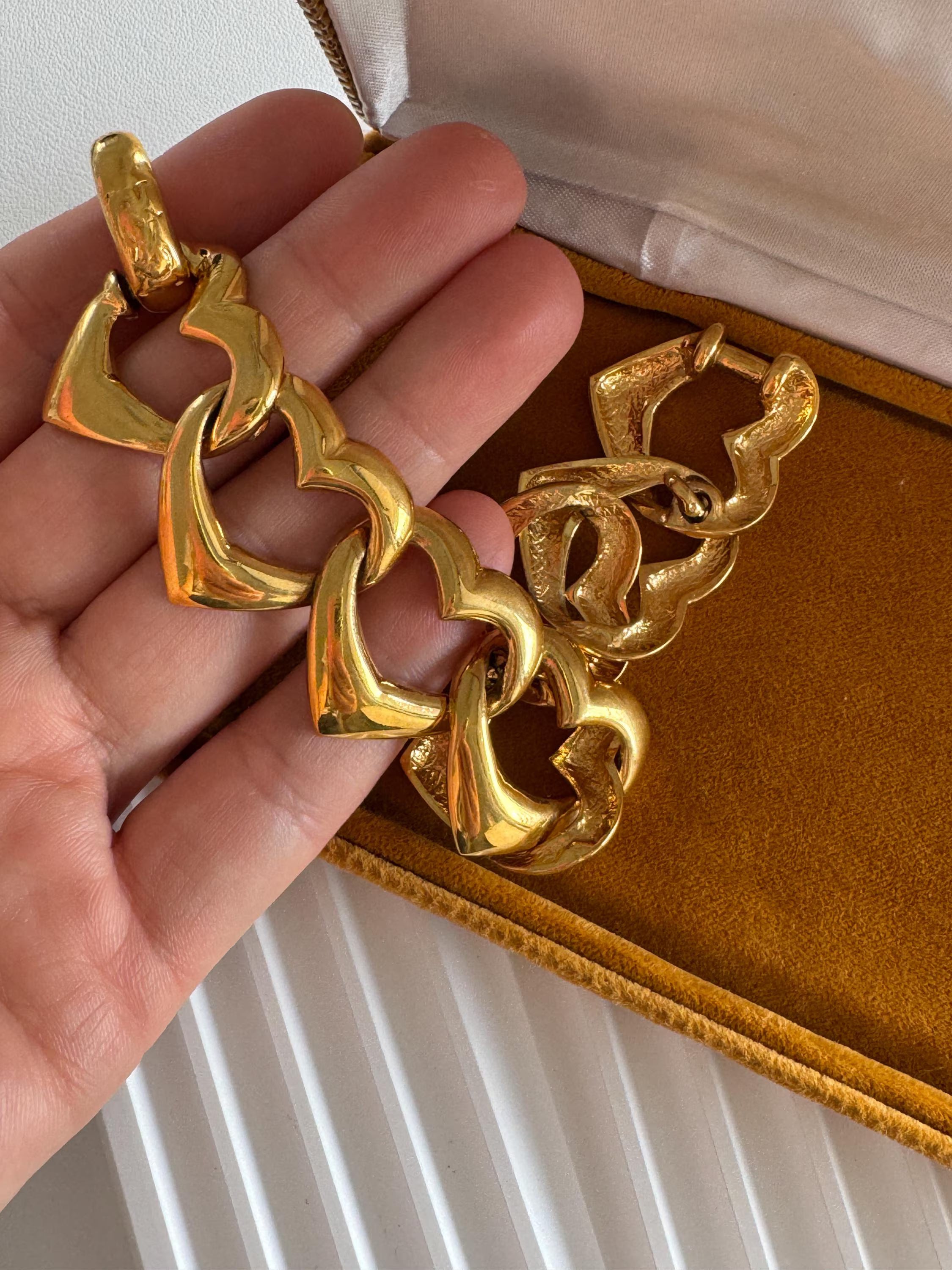 Vintage Yves Saint Laurent gold heart link bracelet with romantic luxe aesthetic