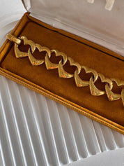 Vintage YSL gold heart link bracelet, feminine statement jewelry with modern edge