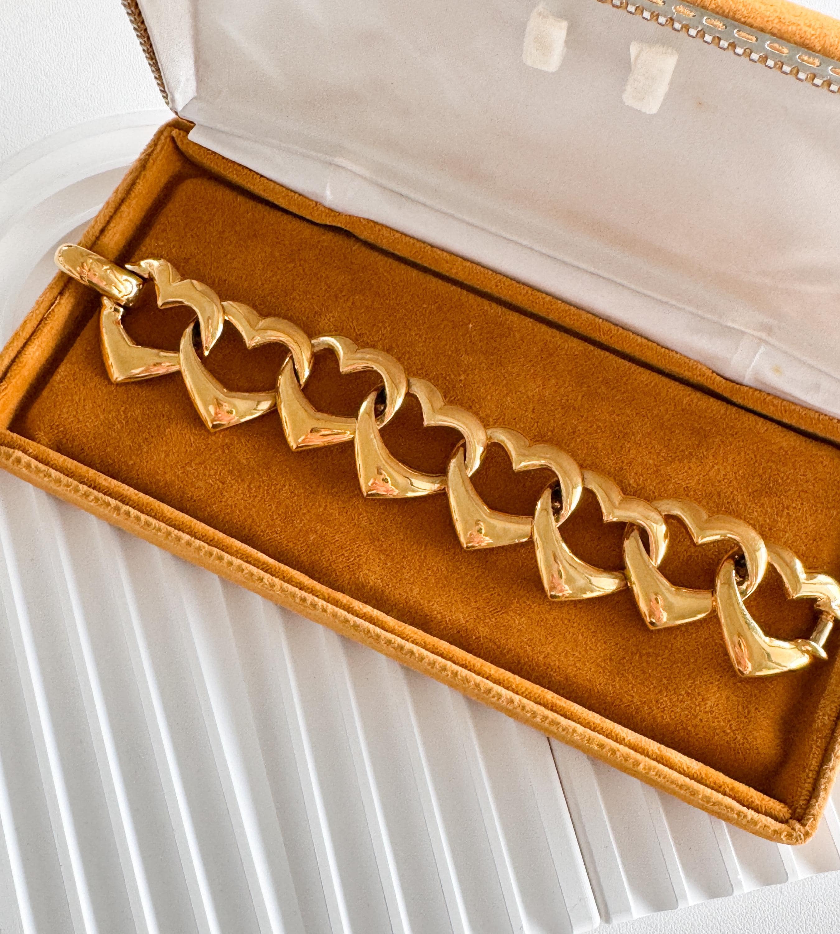 Vintage Yves Saint Laurent gold heart bracelet with bold romantic fashion vibe