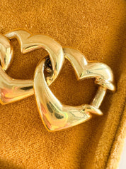 Vintage Yves Saint Laurent gold heart link bracelet with romantic luxe aesthetic