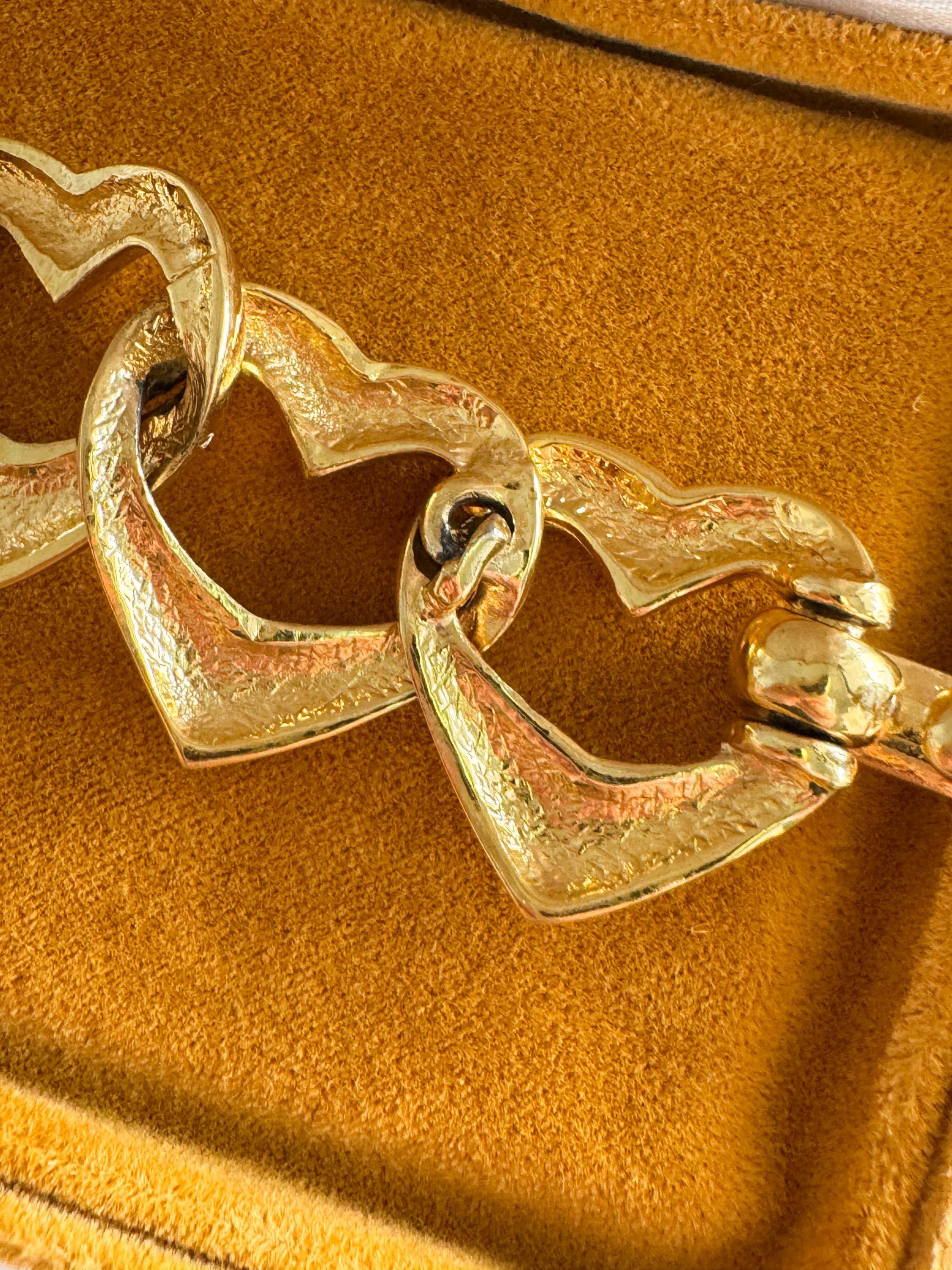Vintage Yves Saint Laurent gold heart link bracelet with romantic luxe aesthetic