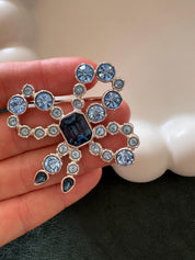 Vintage YSL royal blue cabochon ribbon brooch in silver tone, iconic designer statement jewelry for women
